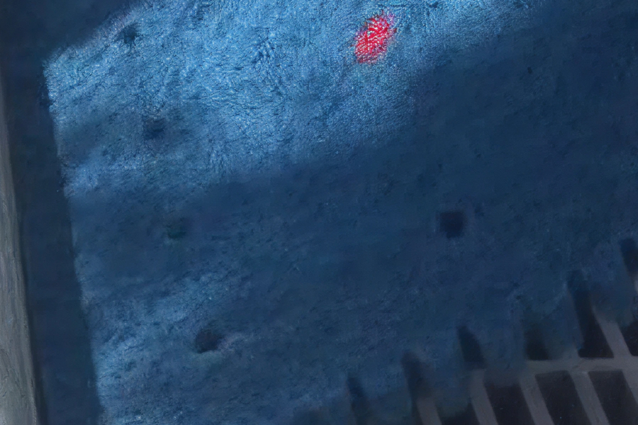 Dark blue filter fabric covering a drain inlet, with a small red marker and visible grates in the bottom right.